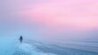 Soft pink skies frame a serene beach setting, where a lone figure strolls along the shore