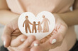 hands holding paper family cutout, foster care, homeless support, world mental health day, Autism support,homeschooling concept