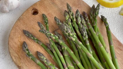 Canvas Print - Fresh Asparagus Arranged on Cutting Board