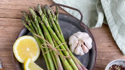 Wall Mural - Array of Asparagus, Lemon, Garlic, Pepper on Plate