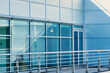 Building exterior highlights modern design, reflective windows