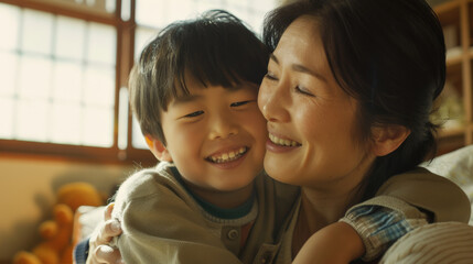 Affectionate moment between smiling Japanese mother and Japanese son at home, showcasing a warm, loving family dynamic