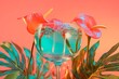 Exotic Flowers in Water Glass on Coral Background
