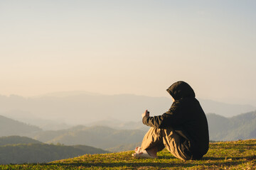 Wall Mural - nature traveling with solo man relax and see sunrise with layer of mountain