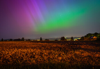 Wall Mural - northern lights over the field in the night in germany