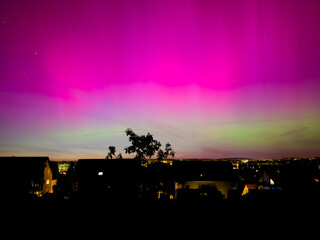 Wall Mural - aurora over the city in the night in germany