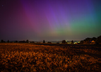 Wall Mural - aurora over the field in the night in germany