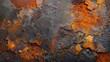 Corroded metal texture with orange and yellow tones on dark background

