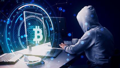 Poster - Side view of hacker at desk using computers with glowing round bitcoin hologram with polygonal mesh and bokeh circles on blurry blue background. Digital banking, money and finance concept.