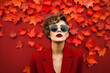 © smth.design - Stylish Woman in Red with Sunglasses Against Autumn Leaves Background
