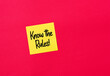 Know the rules message on a yellow sticky note paper on red background.