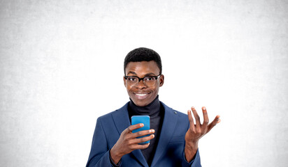 African man with smartphone in hand, copy space background