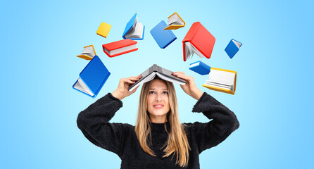 A woman smiling with a book on her head surrounded by colorful f