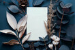 Flat lay of blank white card mockup surrounded by dried leaves and flowers on dark blue background, top view. Bright studio light, minimalist aesthetic, with copy space for text or design.