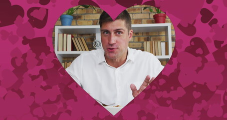 Poster - Image of heart shaped frame over caucasian man talking and eating on image date