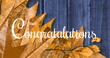 Image of congratulations text over leaves on wooden background