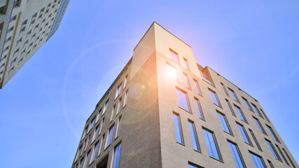 Wall Mural - Modern office building detail. Perspective view of geometric angular concrete windows on the facade of a modernist brutalist style building. 