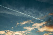 Contrail or condensation trail on sunset sky