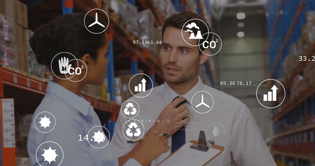 Poster - Image of eco icons and data processing over diverse man and woman working in warehouse