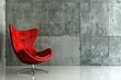 A red chair sits in front of a wall