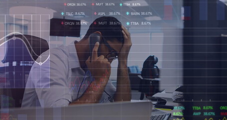 Poster - Image of stock market data processing over stressed biracial man talking on phone at office
