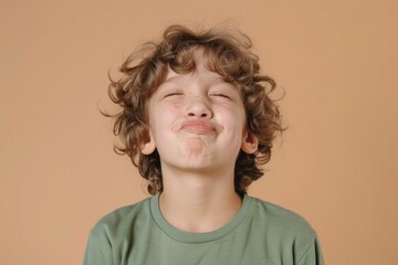 Poster - A young boy with curly hair making a silly expression. Suitable for children's books or educational materials