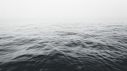 Aufkleber - A serene black and white image of a body of water. Suitable for various design projects