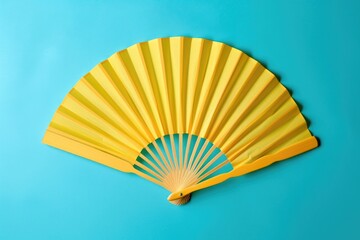 Poster - A vibrant yellow paper fan against a calming blue background. Perfect for summer themed designs