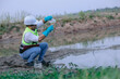 © Chocheng channel - Asian Man experts analyze the water in a contaminated , environment ecology concept