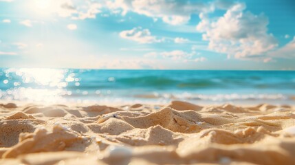 Tropical summer beach with golden sand on blurred background turquoise ocean and blue sky with white clouds on bright sunny day. Colorful landscape for summer holidays.