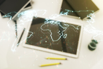Poster - Multi exposure of abstract graphic world map and modern digital tablet on desktop on background, top view, big data and networking concept