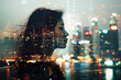 Double exposure portrait of woman with night city skyline