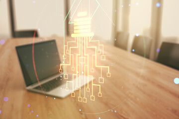 Poster - Double exposure of creative light bulb hologram with chip on laptop background, idea and brainstorming concept