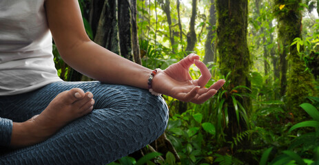 Wall Mural - Woman in meditation position in nature