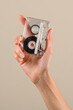 Female hand showing vintage cassette tape