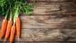 Fresh organic carrots on a wooden background. Autumn harvest, a place for the text. Vegetables are rich in vitamins. Healthy eating.