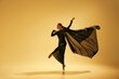 © master1305 - Poetry in motion. Beautiful woman, ballet dancer in elegant black dress performing against sand color background. Concept of art, classical dance, beauty and fashion, aesthetics