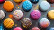 A close-up of colorful macarons with artistic splashes and drizzles, set against a dark contrast background