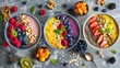 Smoothie bowls with various fruits, nuts, and seeds, displayed on a textured background