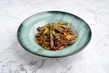 Wall Mural - Udon noodles with beef and vegetables, top view