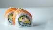 Close-up of a beautifully arranged sushi roll with salmon, shrimp, and avocado, isolated on a white background under studio lighting