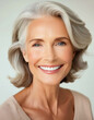 © Wirestock - Portrait of a middle-aged woman with grey hair, AI-generated.