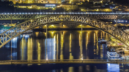 Wall Mural - Timelapse of The Dom Luis I Bridge over Douro River between the cities of Porto and Vila Nova de Gaia, Portugal