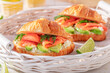 Golden and healthy french croissant with salmon and avocado