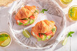 Healthy and homemade french croissant with fish and avocado.