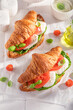 Fresh and golden french croissant with tomatoes and mozzarella