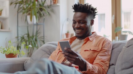 Sticker - Smiling Man Using Smartphone at Home