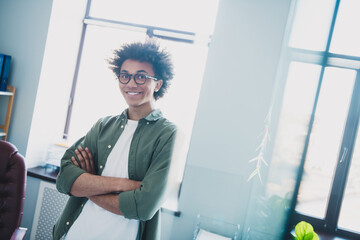 Sticker - Photo of good mood attractive boss dressed khaki shirt eyewear arms folded indoors workshop workplace