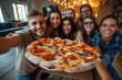 © BUDDHA - Friends eating a pizza, taking a group selfie and having fun during a house party