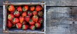 © Ilja - Organic strawberries in a vintage wooden storage basket, perfect for a rustic and natural display
